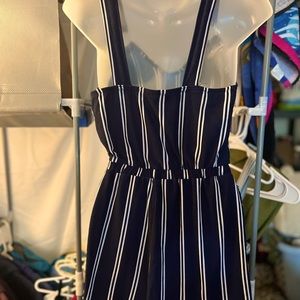A cute little navy blue with white stripes romper. Size small.